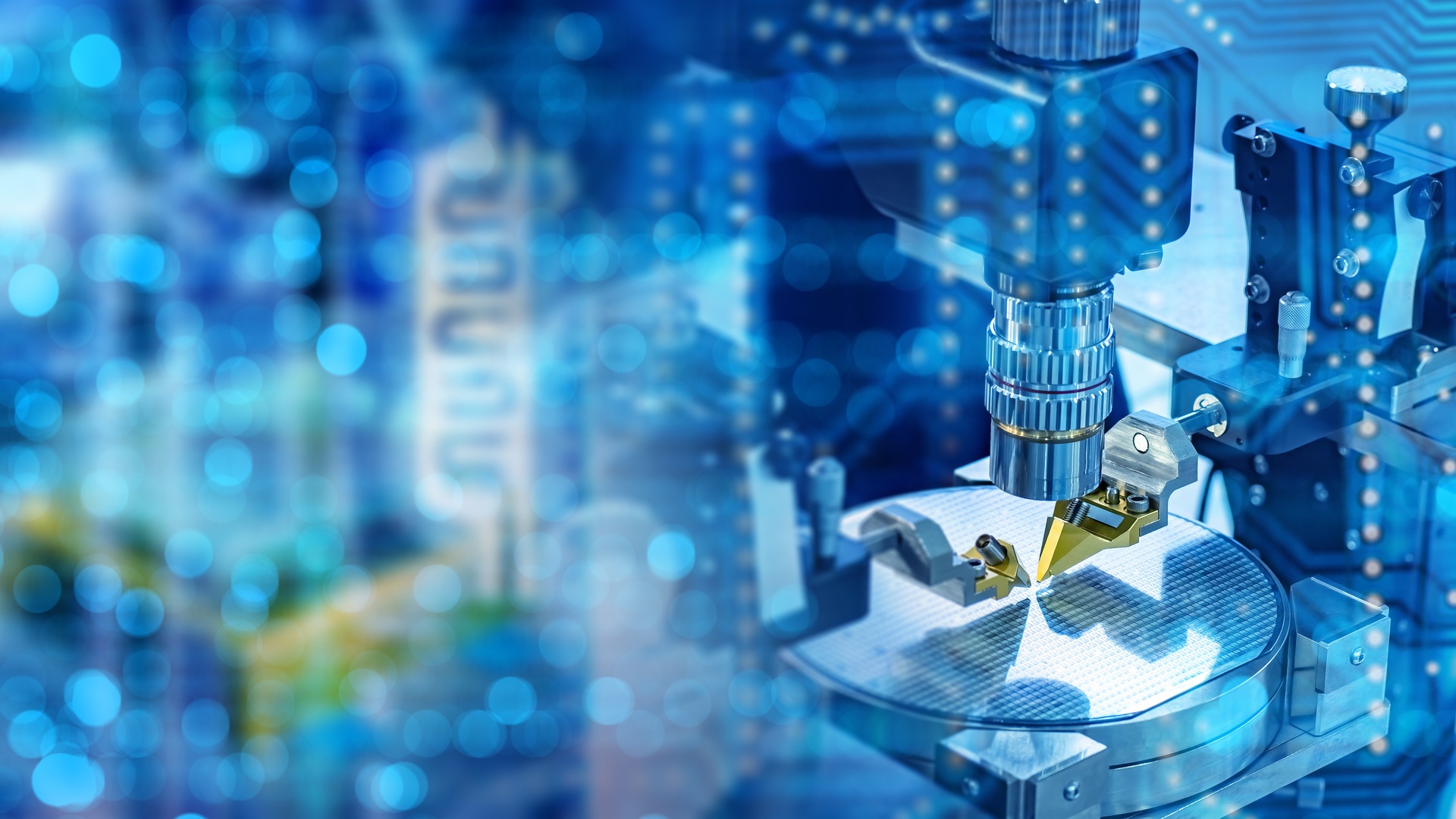 Close-up of a precision testing probe above a silicon wafer, surrounded by blue machinery and glowing circuit graphics.